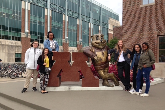 Students next to Goldy Gopher Statue.