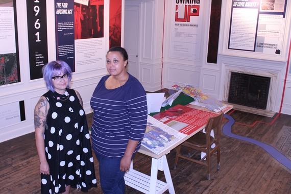 Denise Pike and Kacie Lucchini Butcher standing in their exhibit