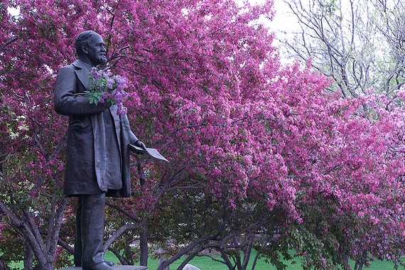 Statue of John S. Pillsbury, father of the University, with lilacs