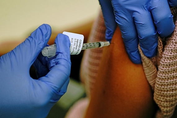 A hospital employee receiving a dose of the Moderna coronavirus disease vaccine at Rady Children's Hospital in San Diego, California.