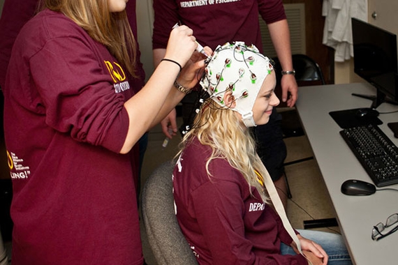Individuals participating in research.  Wearing a brain cap.