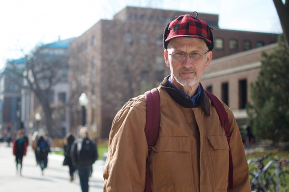 Senior University student John Hartman poses for a portrait outside of Lind Hall on Thursday, Nov. 15.
