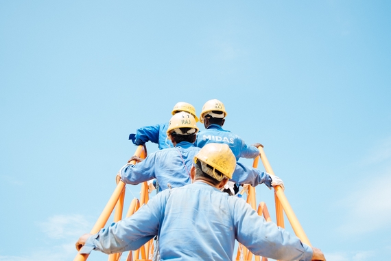 Photo of construction workers by sol on Unsplash