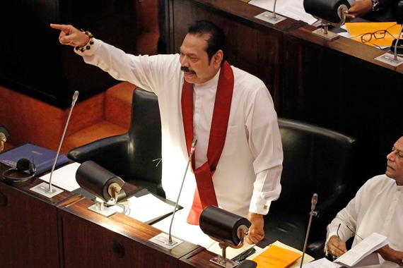 Mahinda Rajapaksa, prime minister of Sri Lanka, addressing the legislature, pointing a finger