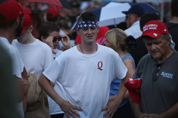 People dressed in American flag garb and "Make America Great Again" baseball caps