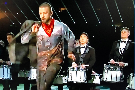 Justin Timberlake singing at the Superbowl halftime show with the U of MN drumline playing behind him