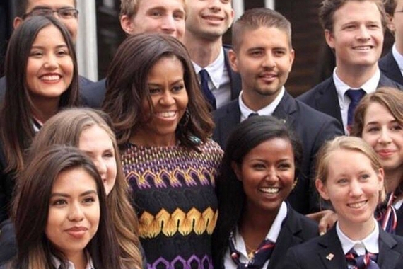 Undergraduate student Hanna Worku pictured standing next to former First Lady Michelle Obama in a group photo 
