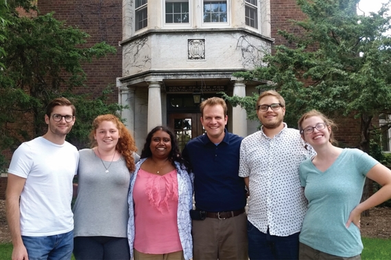 Group of graduate students posing together in front of Nolte Center