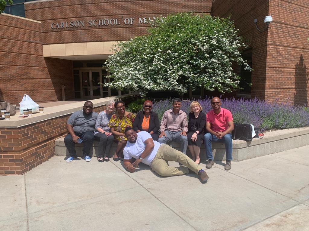 Delegates from Jamaica and participants in the Jamaica Summer Arts Camp pose in front of Carlson 