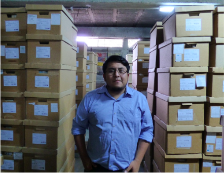 Heider Tun working at the Guatemala National Police Archives located in Guatemala City, Guatemala.