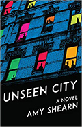 Cover image of Amy Shearn's Unseen City, with blue-tinted brick appartment buiding, windows in hot pink, red, green, orange, with black silhoettes of people