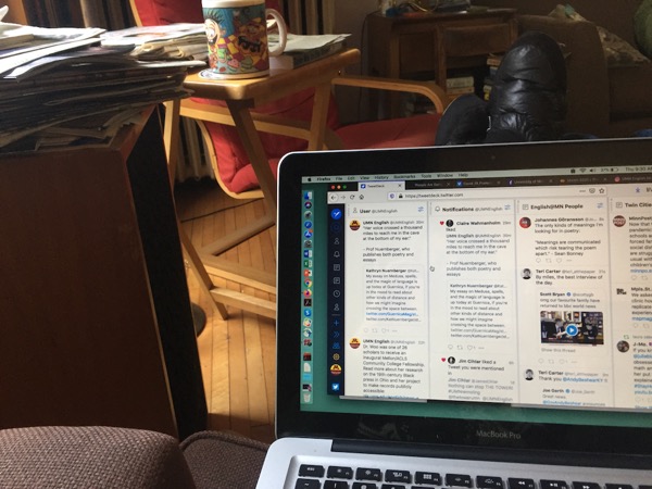 Photo of Sutton home office: laptop, chair, stack of papers on speaker